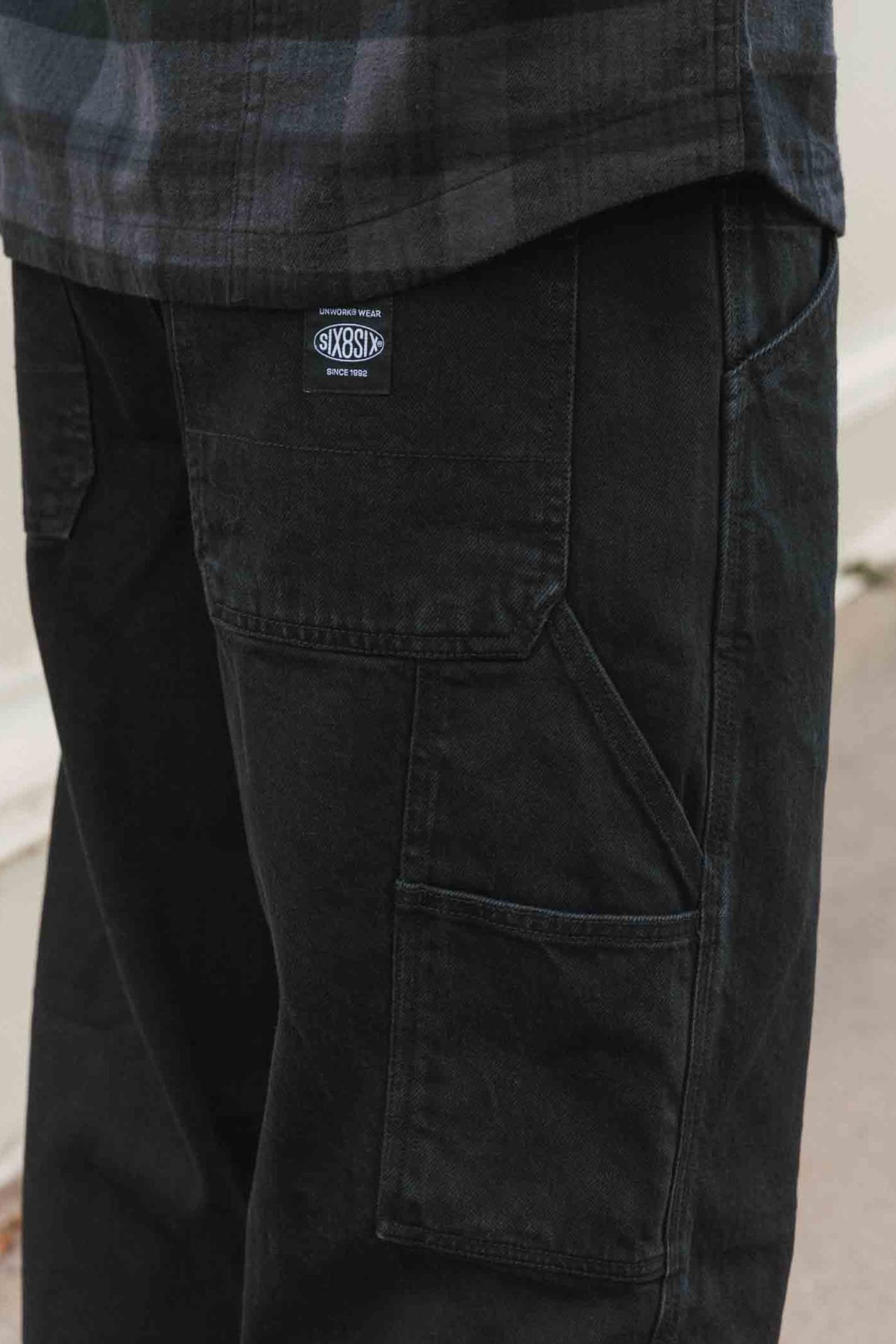 Black 686 Men’s Unwork® Hammerhead Denim Pant utility work pants featuring multiple pockets and a branded patch on the back pocket.