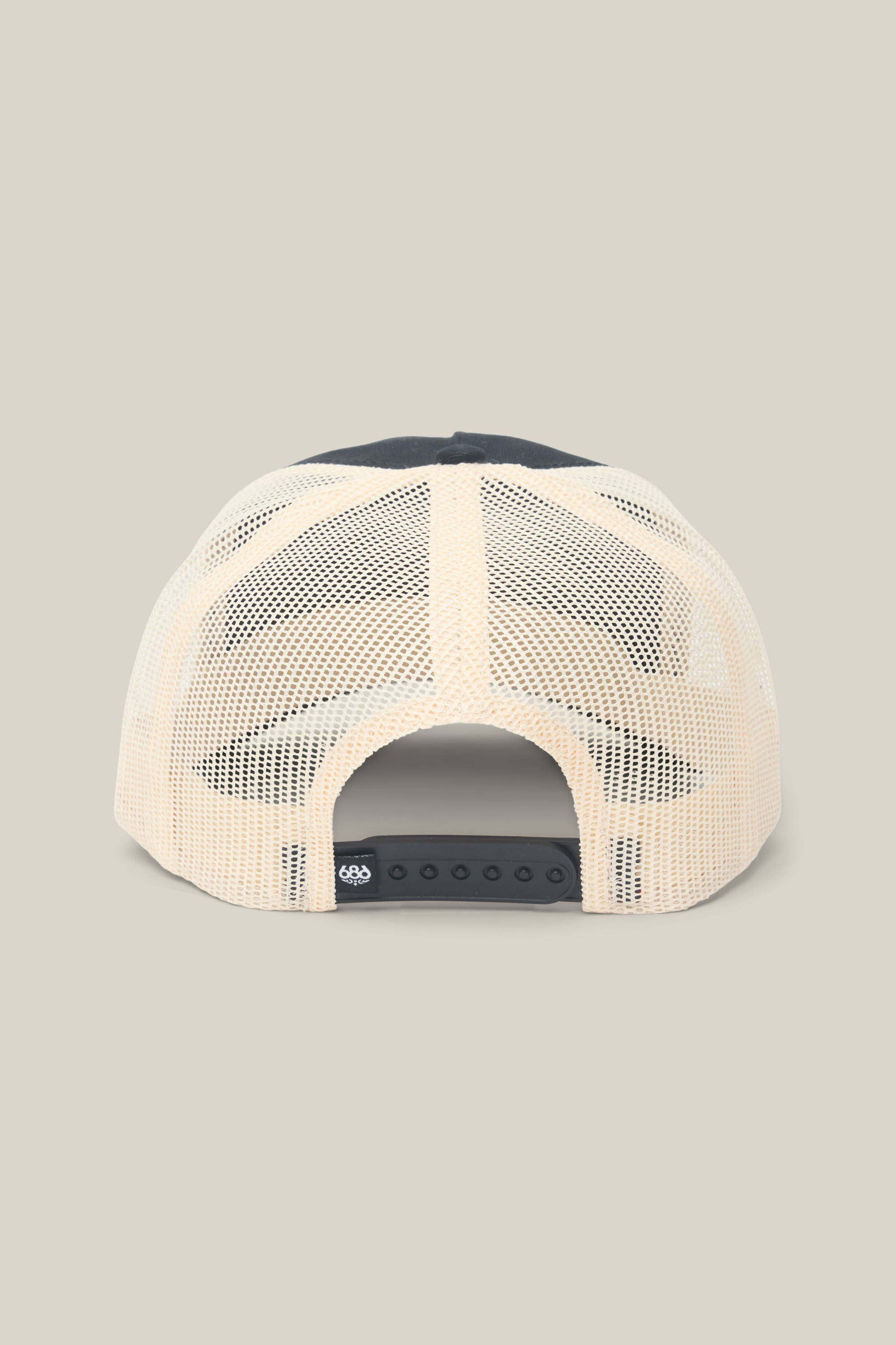 The 686 Mid-Pro Wreath Unstructured 5 Panel Mesh Hat by 686 is shown from behind, featuring a beige mesh back, black adjustable snapback closure, and a small black tag with a white logo on a plain light beige background.