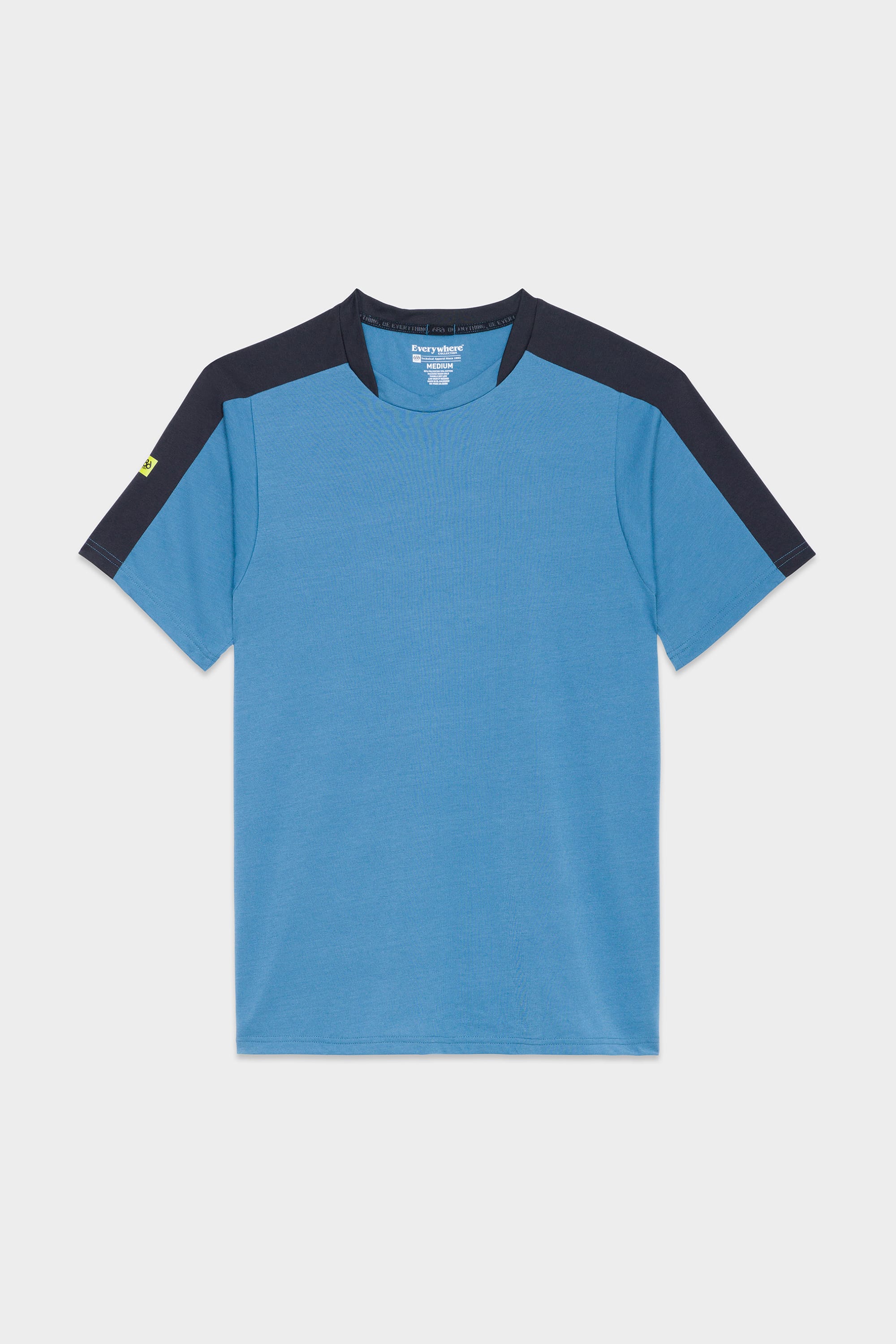 The 686 Mens Rival Short Sleeve Bike Jersey by 686 features blue fabric, dark navy panels on the shoulders and sleeves, and a small yellow detail on the left sleeve, shown against a plain white background.