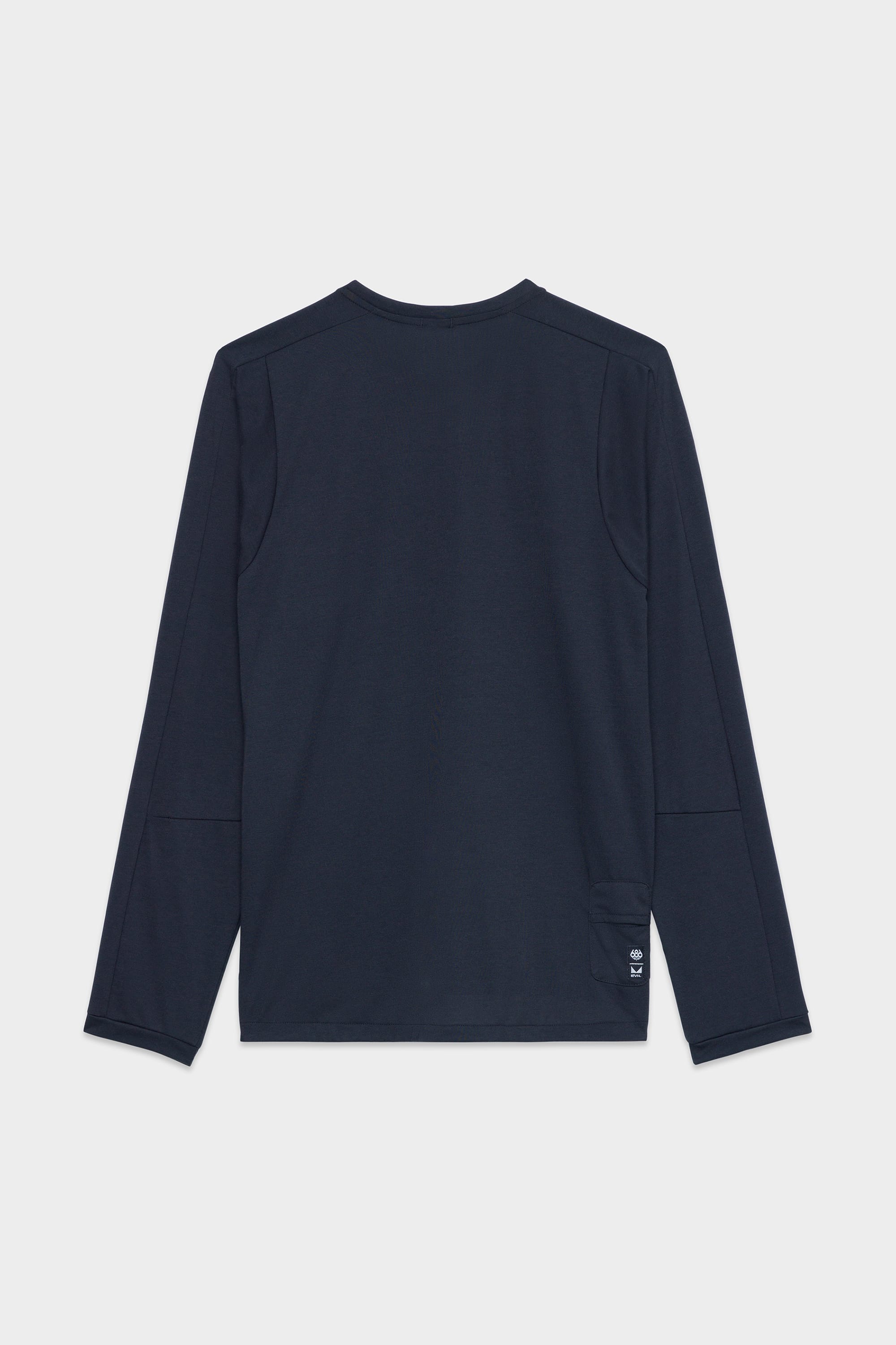 The 686 Mens Rival Long Sleeve Bike Jersey by 686 is shown laid flat, back facing up, on a white background. It’s navy blue with a small white logo near the left bottom hem.