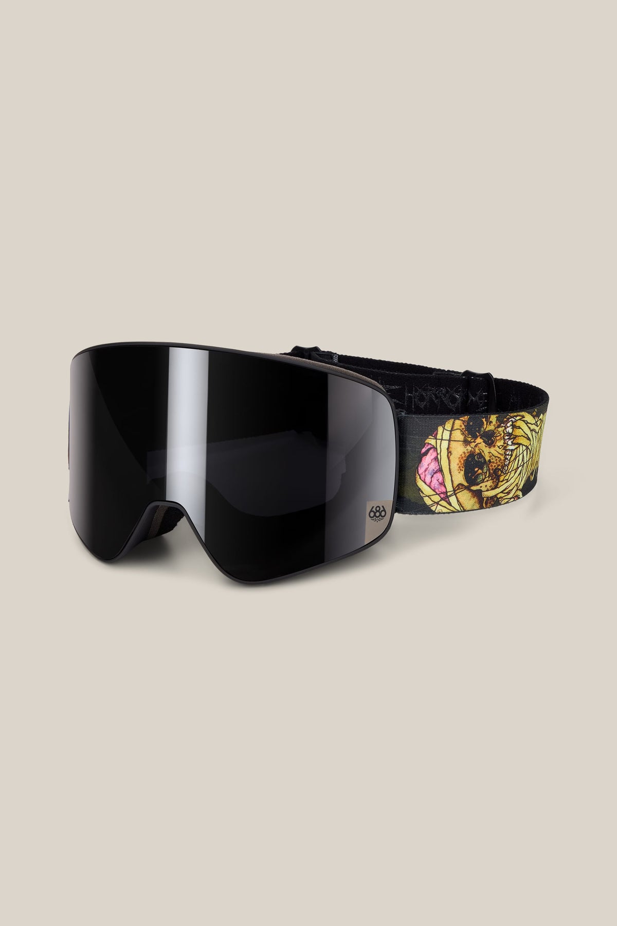 686 SMARTY® Magnetic Goggle with dark, magnetic lenses and a strap featuring a yellow skull graphic.