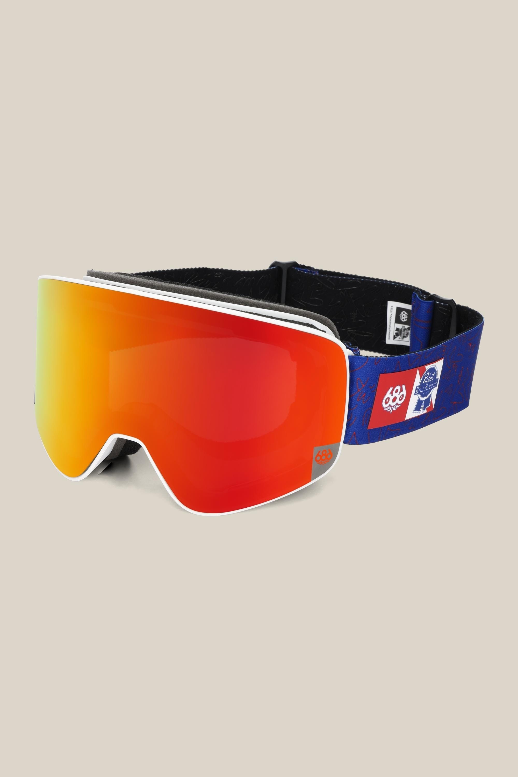 The 686 SMARTY¨ Magnetic Goggle by 686 features a wide red-orange reflective lens and a blue adjustable strap with white and red logos, shown against a light beige background.