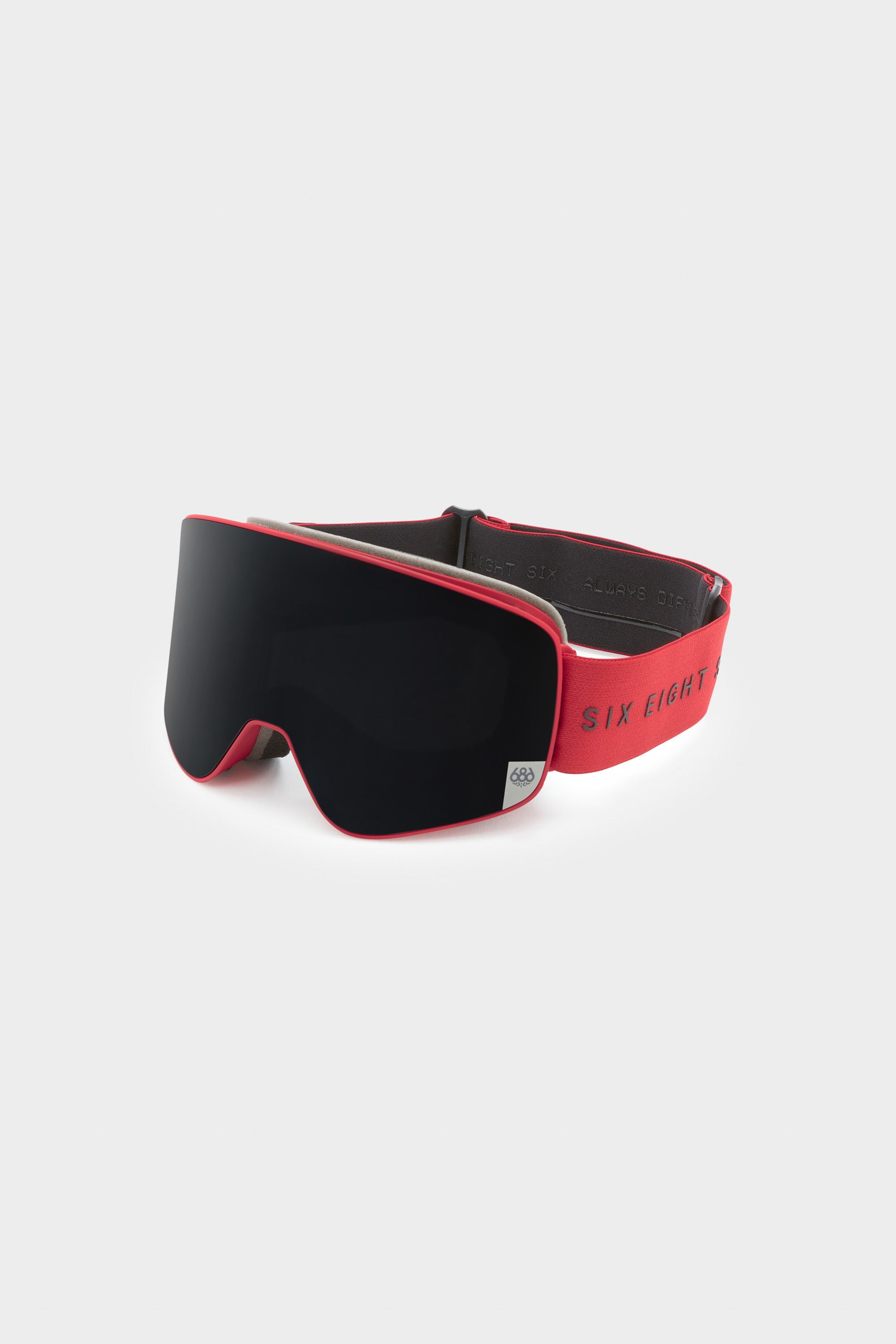 The 686 SMARTY® Magnetic Goggle by 686 features a wide black lens, red frame, and red elastic strap embroidered with "SIX EIGHT," shown against a light grey background.