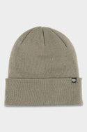 The 686 Standard Roll Up Beanie by 686 is a light gray knit hat with a folded brim and a small black rectangular tag featuring a white logo on the cuff, shown against a white background.