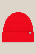 The 686 Standard Roll Up Beanie by 686 is a bright red knit hat with a folded brim and a small black rectangular cuff tag featuring a white logo. Displayed on a plain beige background.