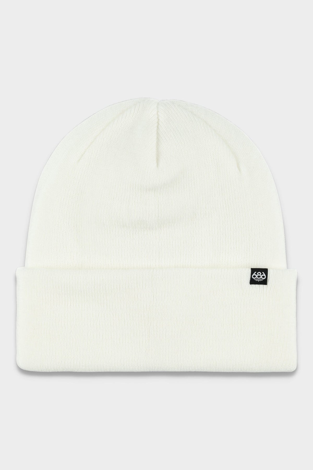 The 686 Standard Roll Up Beanie by 686 is a plain white knit beanie featuring a folded brim and a small black tag with a white logo on the front right side.