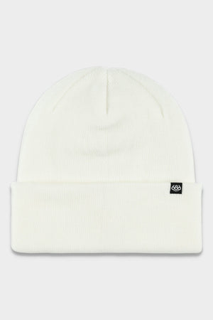 The 686 Standard Roll Up Beanie by 686 is a plain white knit beanie featuring a folded brim and a small black tag with a white logo on the front right side.