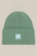 The 686 Big Cuff Beanie by 686 is a green knit hat with a wide folded cuff and a white patch featuring 686 in stylized text, shown on a plain beige background.