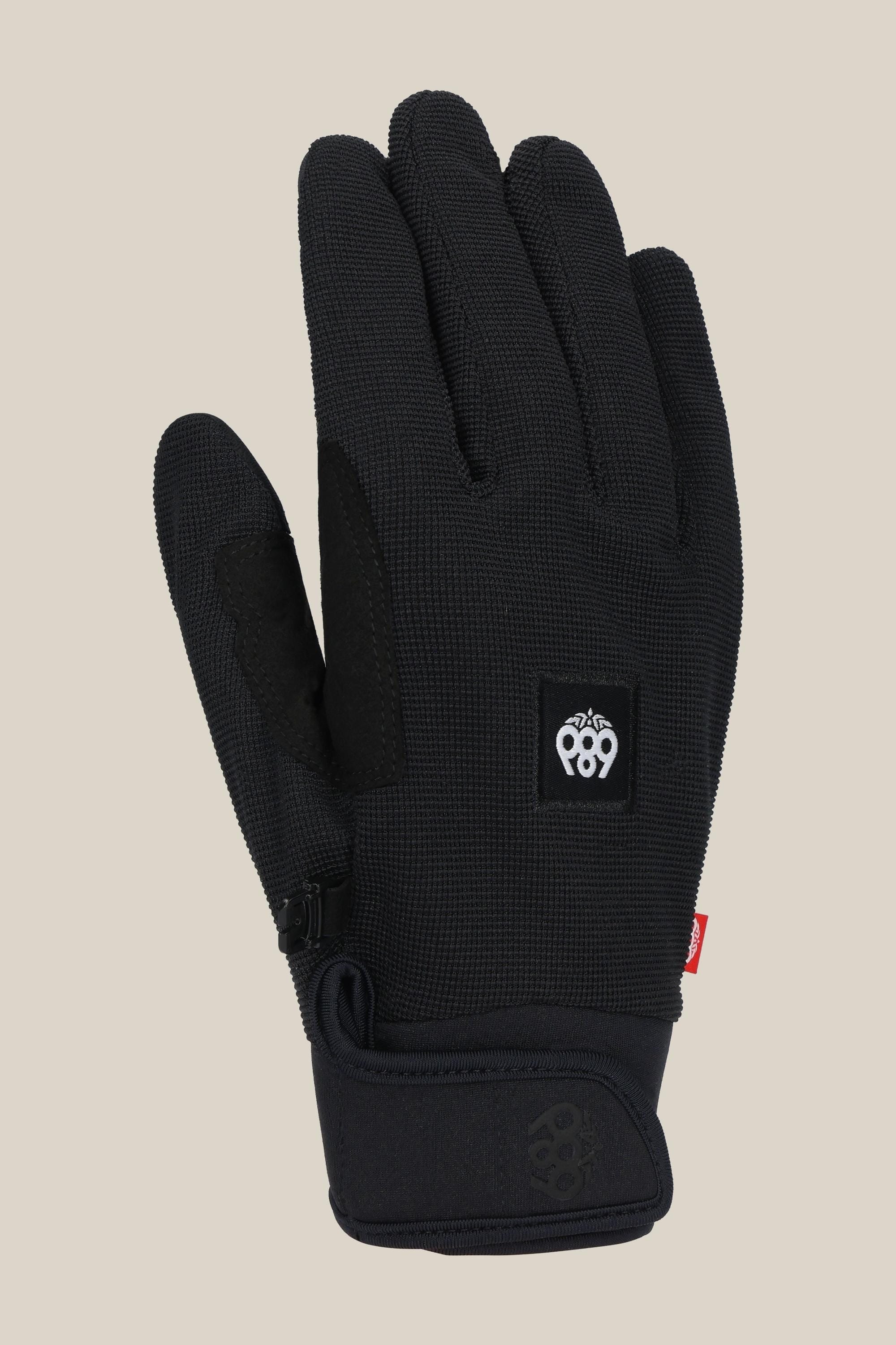 The 686 Outlaw Pipe Glove by 686 is a black textured glove featuring a small white logo on the back of the hand and a red wrist tag, shown upright against a beige background.