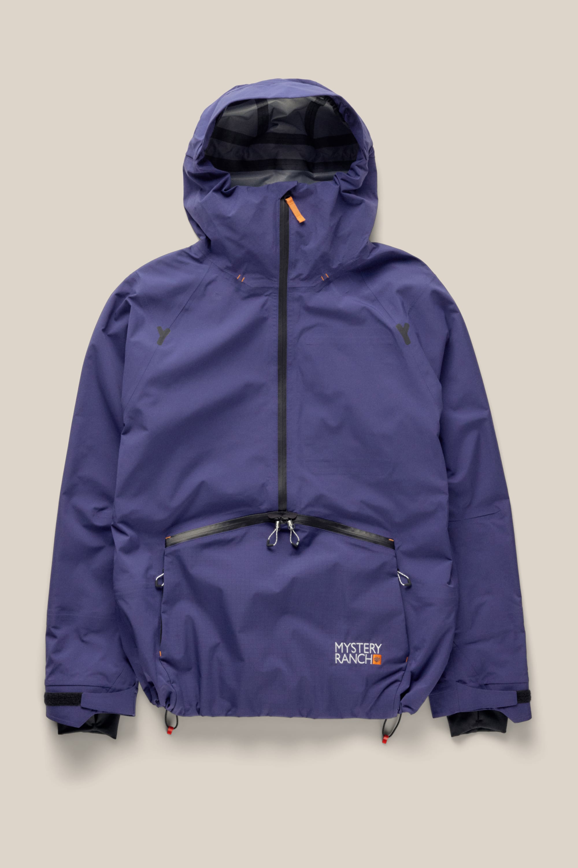 The 686 Men's Mystery Ranch Qi 3L Shell Jacket features a hood, black front zipper, large front pocket, and Mystery Ranch logo on the lower right pocket. This purple polyester waterproof jacket by 686 is shown on a beige background.
