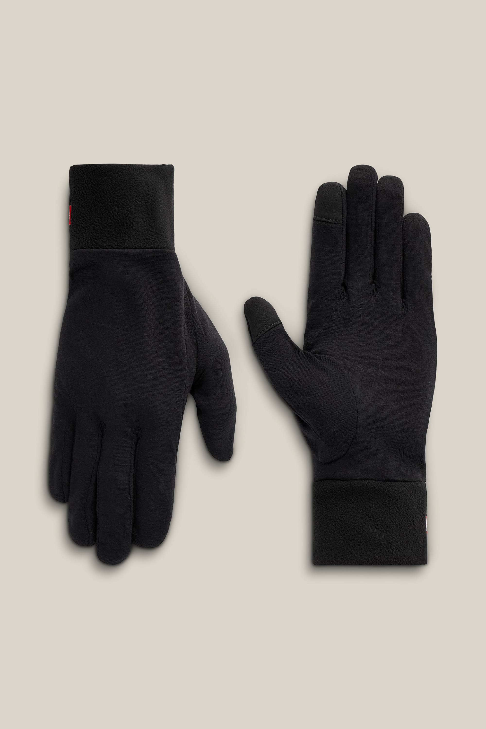 The 686 Men’s GORE-TEX® SMARTY® 3-In-1 Gauntlet Mitt from 686 is displayed on a beige background, with one mitt facing palm up and the other palm down.