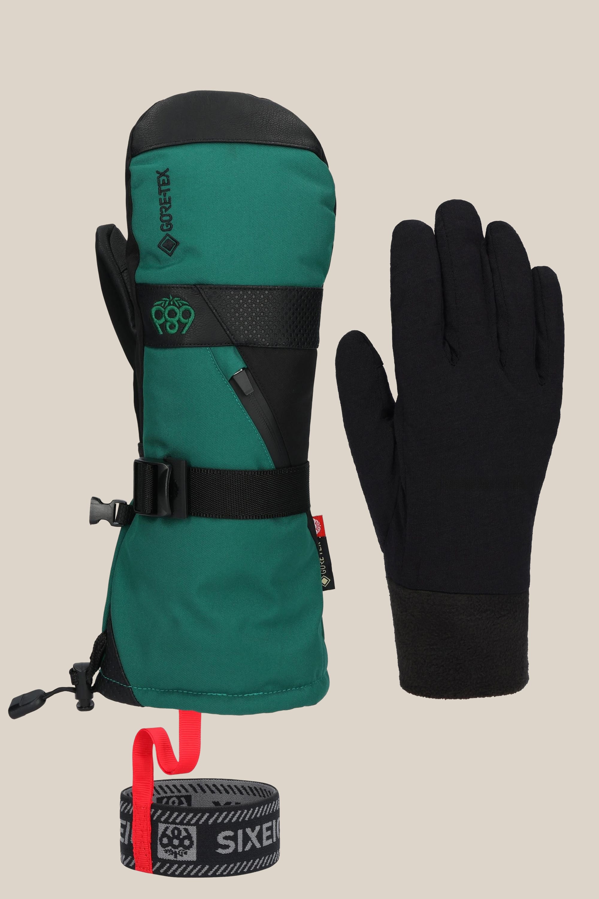 The 686 Men's GORE-TEX SMARTY® 3-In-1 Gauntlet Mitt by 686 is a green and black insulated PU mitt with Gore-Tex technology, including a black glove liner and black/red wrist leash, shown on a plain beige background.