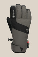 The 686 Men's GORE-TEX Linear™ Under Cuff Glove is a gray and black PU winter glove with adjustable wrist strap and small clip, ideal for cold weather activities.