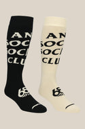 The 686 Men's ASSC Socks - 2 Pack by 686 features one black sock with white lettering and one white sock with black lettering, both displaying ANTI SOCIAL SOCIAL CLUB in a bold, split design.