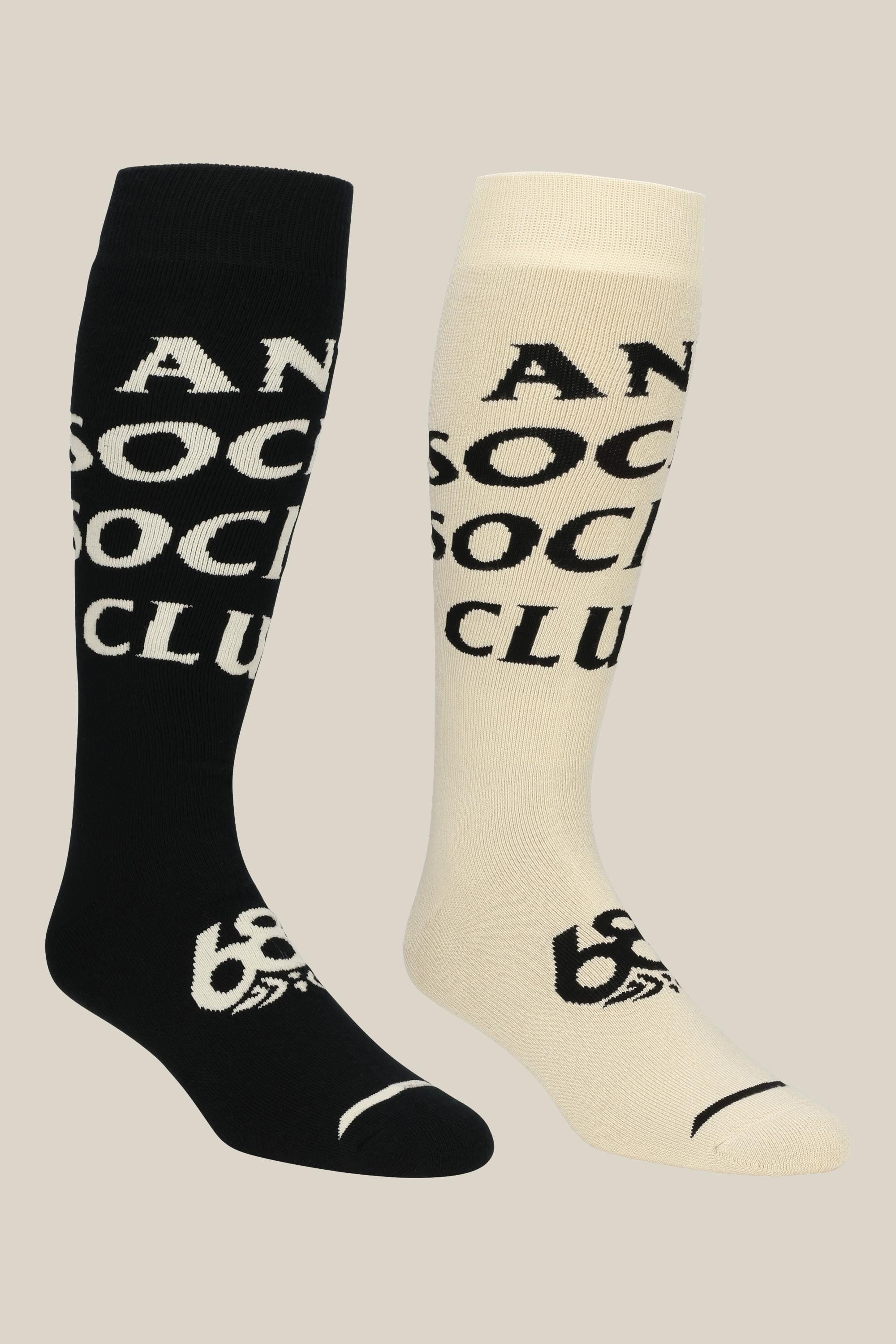 The 686 Men's ASSC Socks - 2 Pack by 686 features one black sock with white lettering and one white sock with black lettering, both displaying ANTI SOCIAL SOCIAL CLUB in a bold, split design.