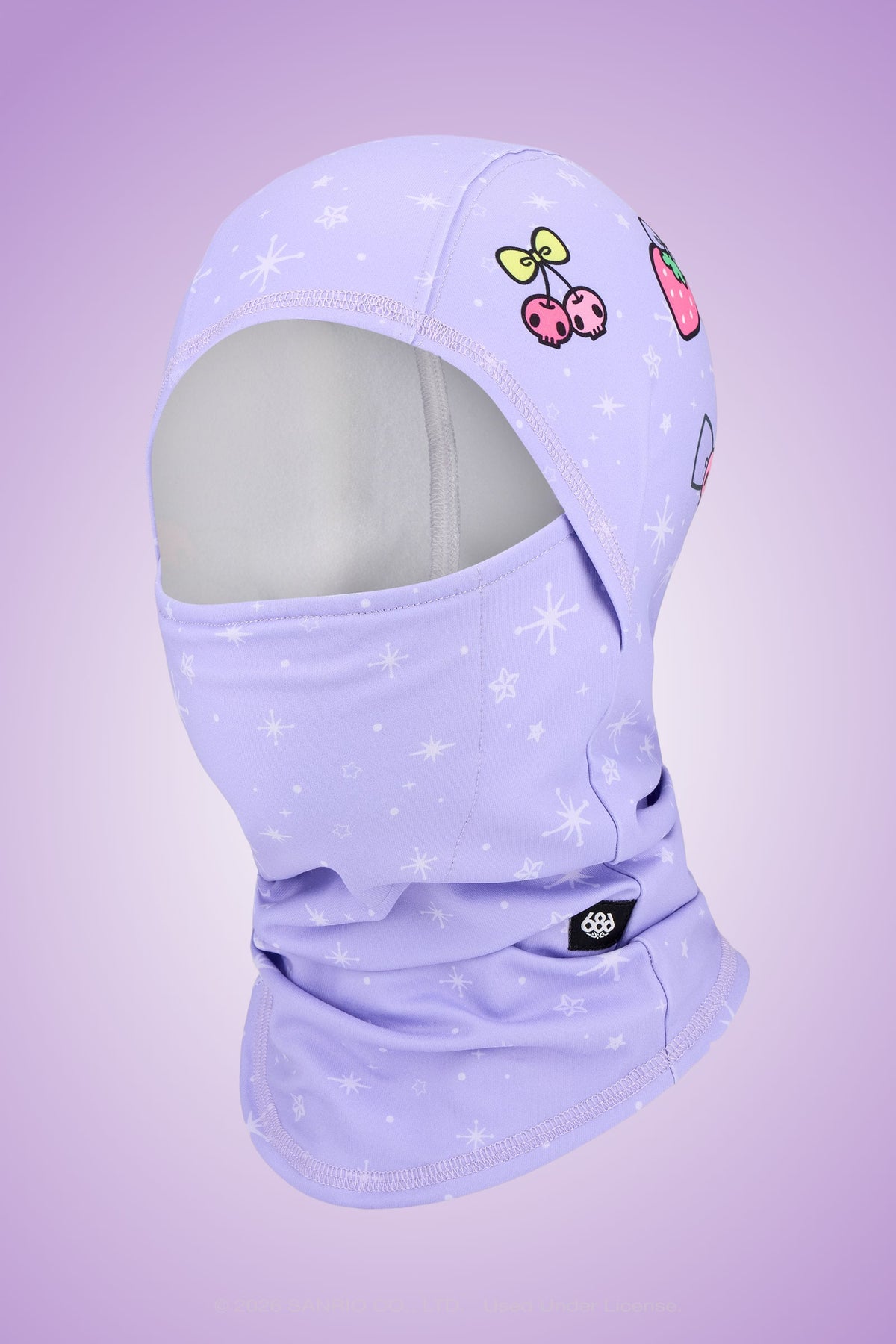 The 686 Hurra Hinged Balaclava by 686, featuring a lavender color with white star patterns and colorful cartoon patches — including a butterfly and a mushroom — is displayed on a mannequin head against a matching purple gradient background.