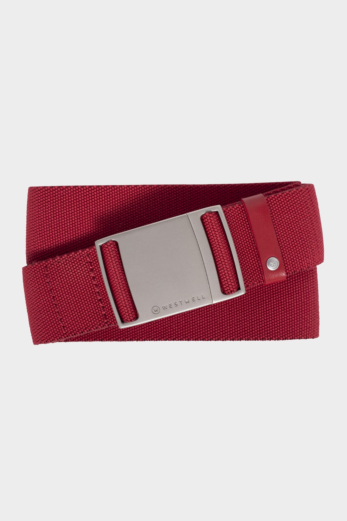 The 686 Westwell Clicker Stretch Belt by 686 is a red fabric belt featuring a rectangular silver buckle and a small metal rivet near the end, shown against a white background.