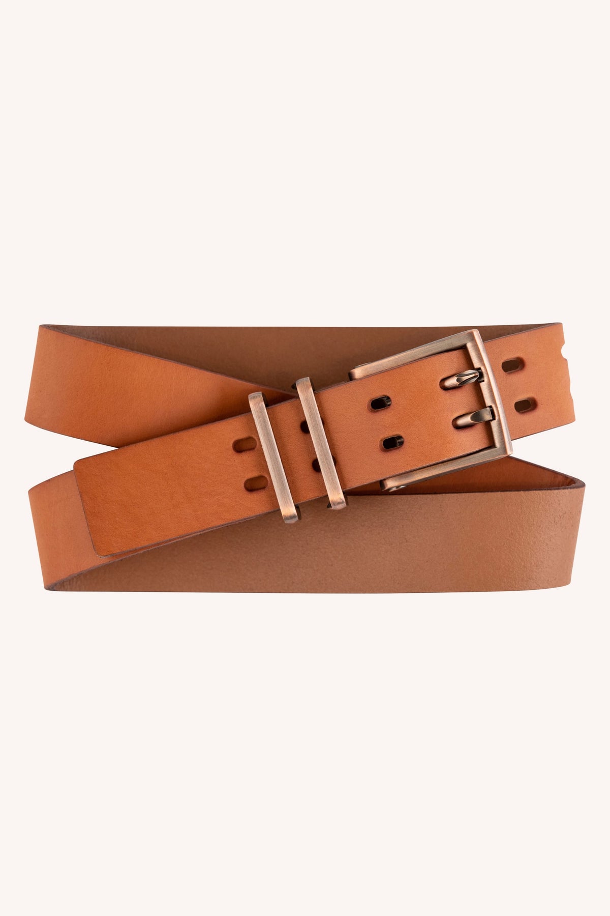 The 686 Westwell Voyager Belt by 686 is a tan leather belt featuring a rectangular metal buckle and two belt loops, neatly coiled against a light background.