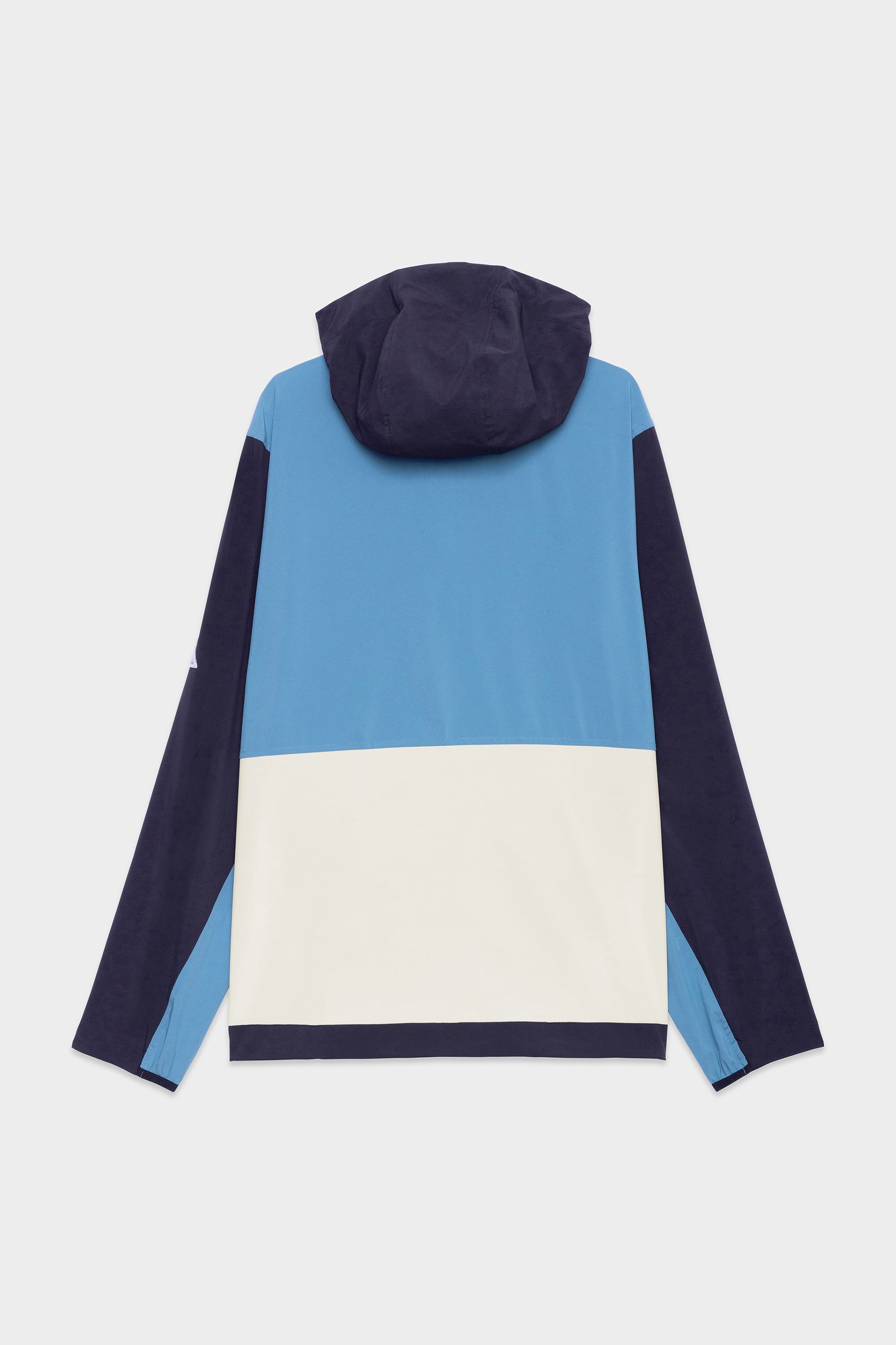 The 686 Mens ATP Stretch Wind Jacket by 686 features a color-blocked design with navy blue sleeves and hood, a light blue upper section, and a white lower panel when viewed from the back.